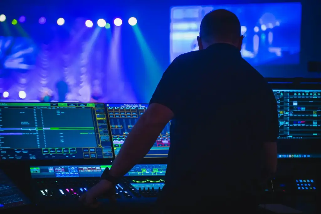 Professional event audio production with soundboard and microphones
