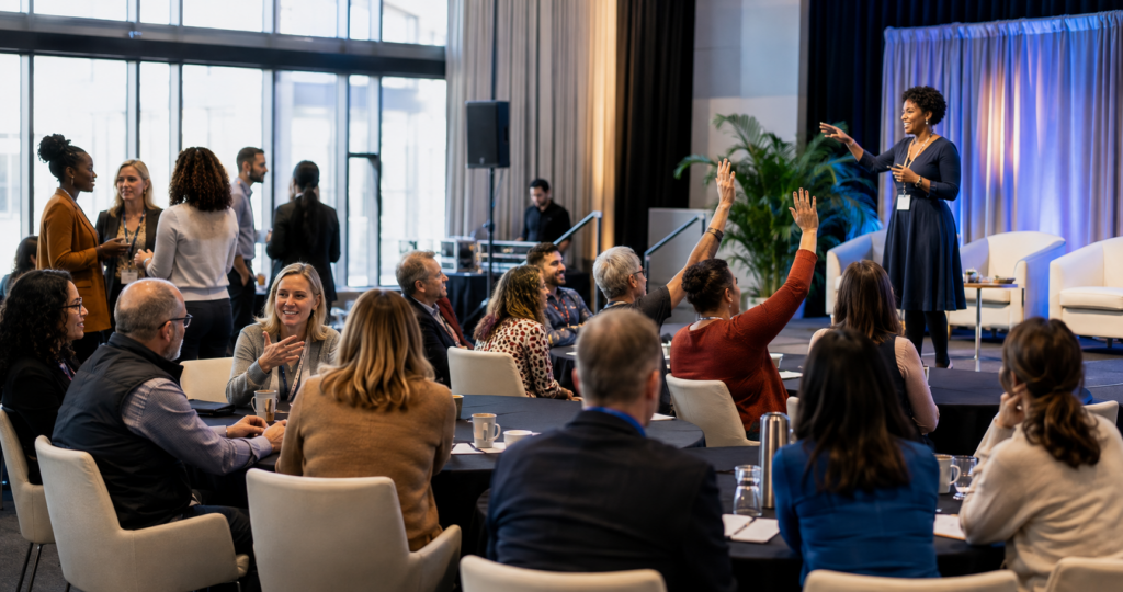 Attendees participating in an interactive conference session while an event producer manages the live program.